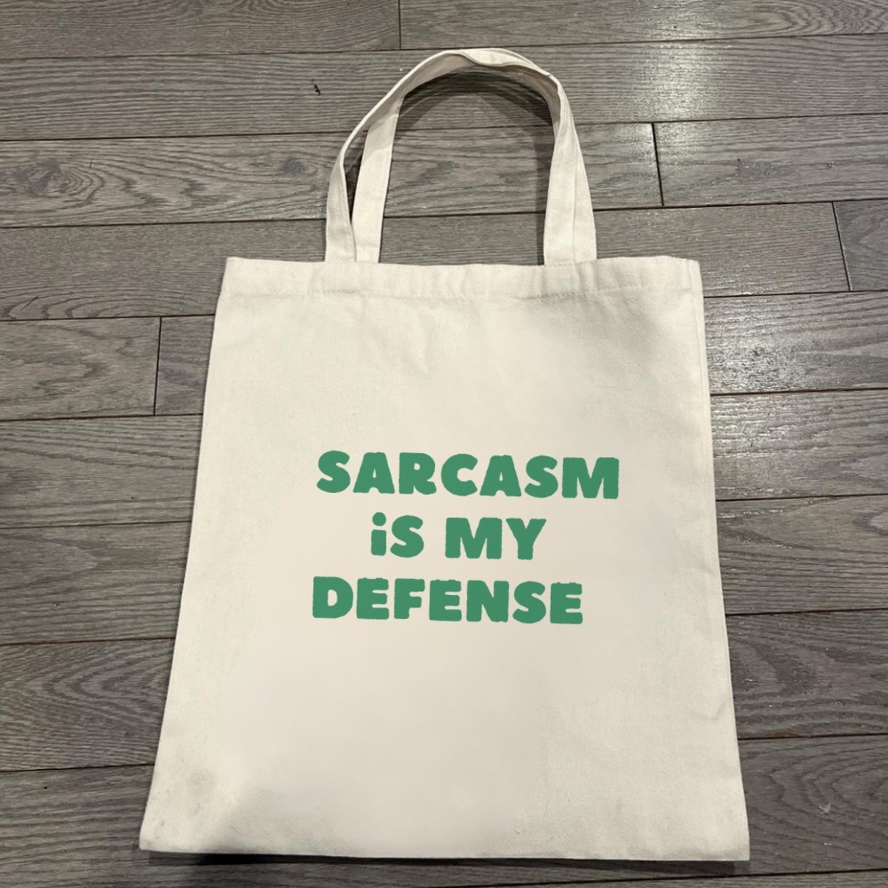 Sarcasm is my defense Tote Bag with Green Text
